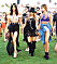 Kendall Jenner, Fergie, and Hailey Baldwin hold hands and dance while walking around Coachella in Indio, CA.