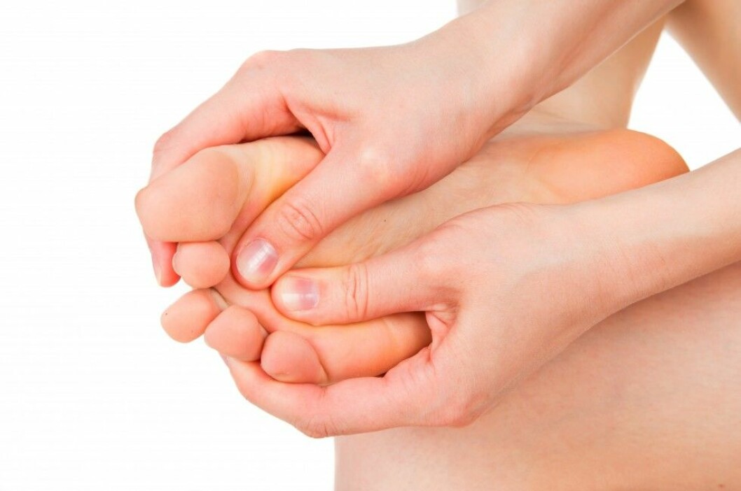 girl rubs cream heel, feet
