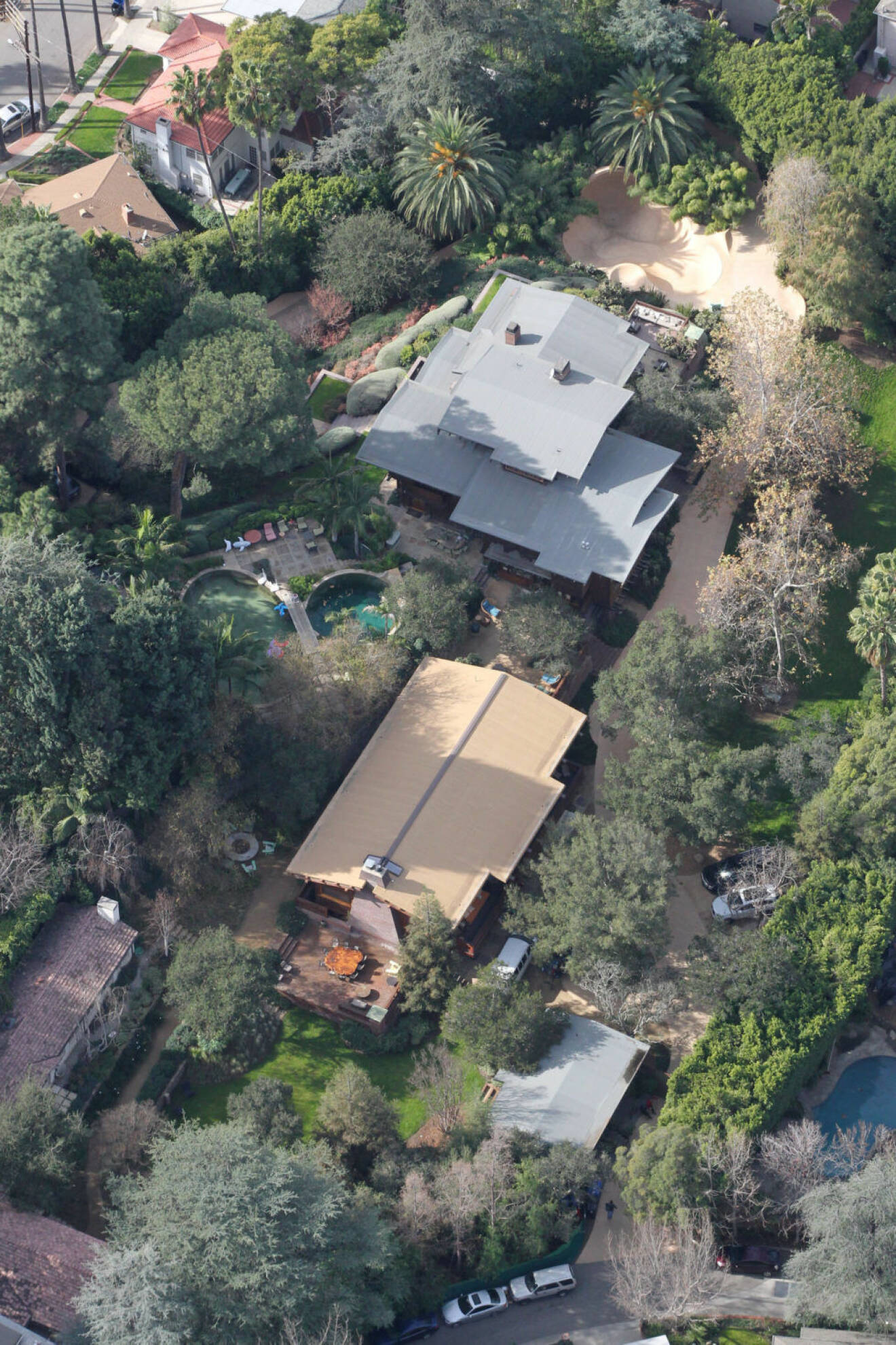 Brad Pitt and Angelina Jolie own this mega-mansion in LAs Los Feliz neighborhood featuring multiple structures, pools, and a full skatepark for their brood