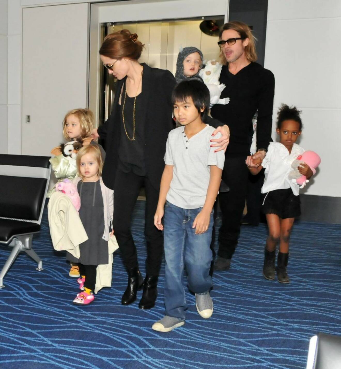 FILE PHOTO: Angelina Jolie files for divorce from Brad Pitt after 11 years together and two years of marriage. According to TMZ.com Jolie gave irreconcilable differences as the reason for the split and is requesting custody of the pairs 6 children. ..Photo shows Brad Pitt, Angelina Jolie, Nov 10, 2011 : Actor Brad Pitt and his family leave Japan on November 10, 2011. (Credit Image: © AFLO via ZUMA Press) (c) Zumapress / IBL