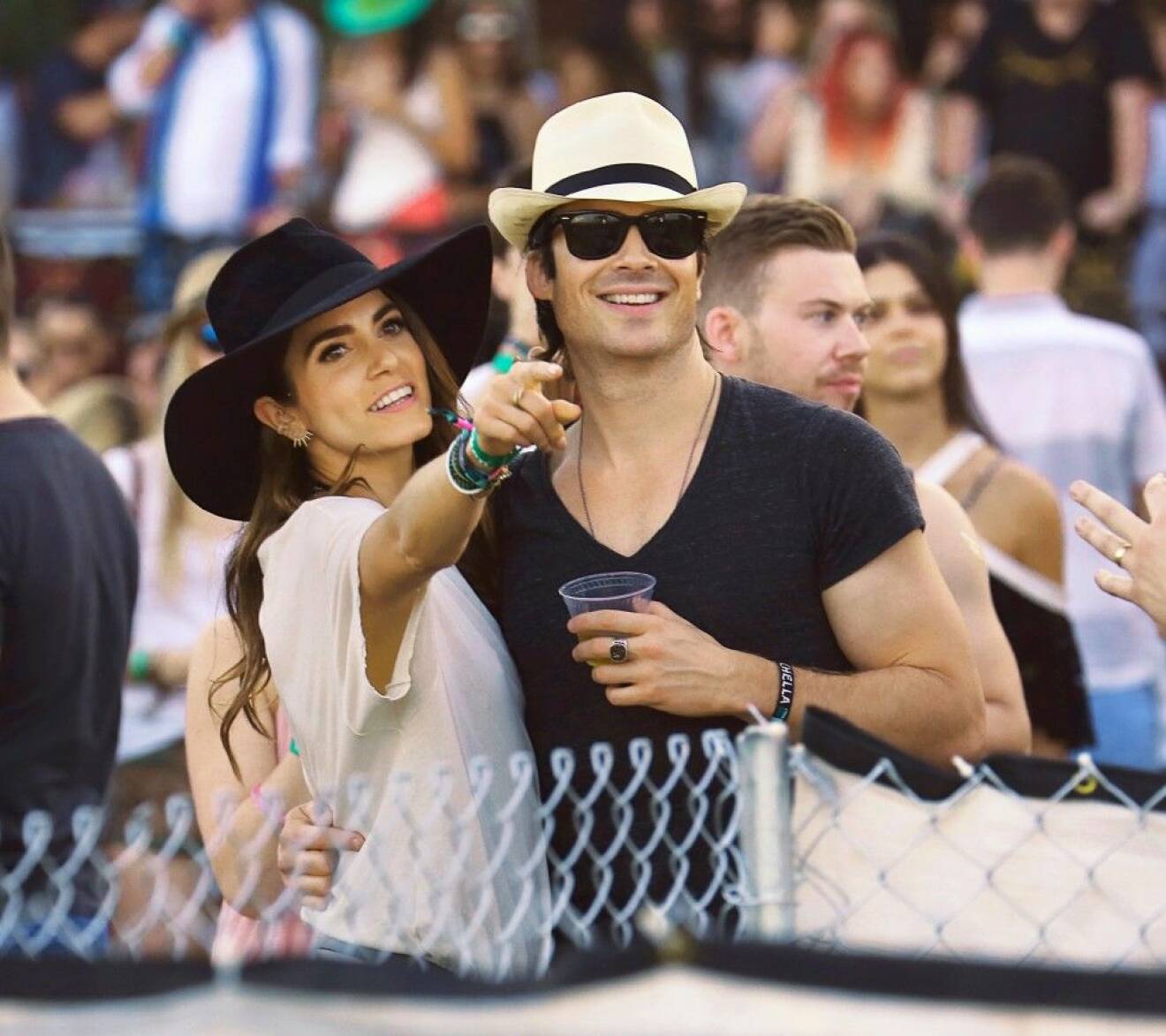 Nikki Reed and fiance' Ian Somerhalder kiss like crazy while watching a show at Coachella in Indio, CA.