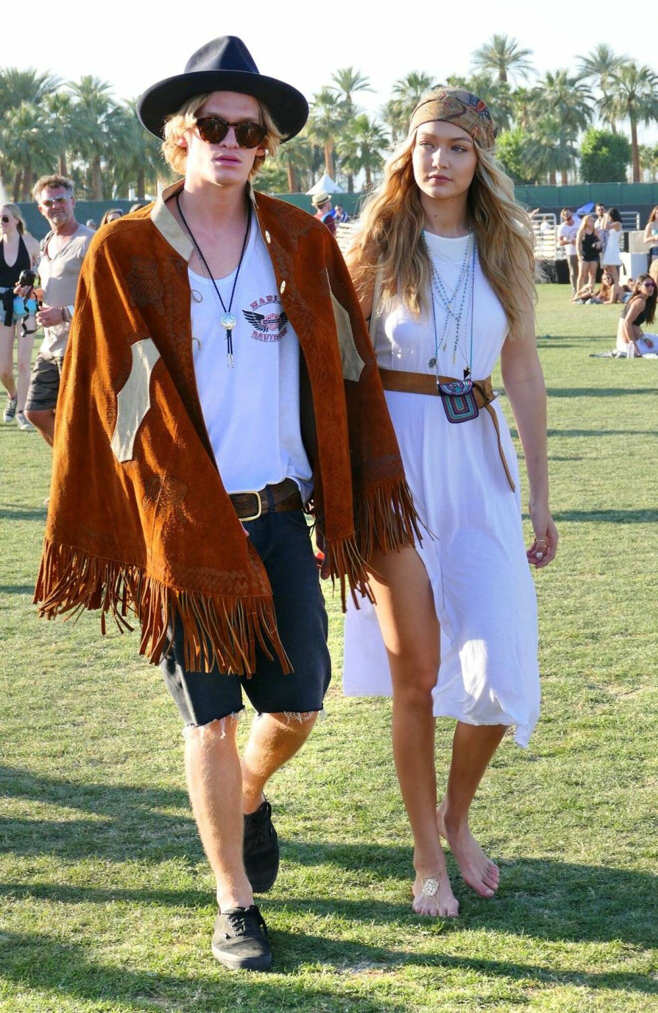 Gigi Hadid walks arm-in-arm with Cody Simpson at Coachella in Indio, CA