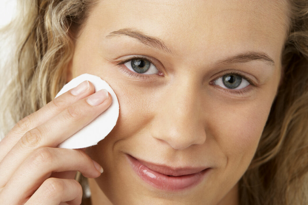 Young Woman Removing Make-Up